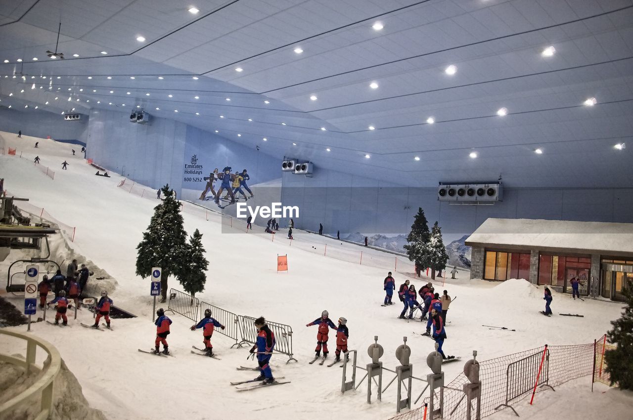 PEOPLE WALKING IN SNOW DURING SNOWFALL