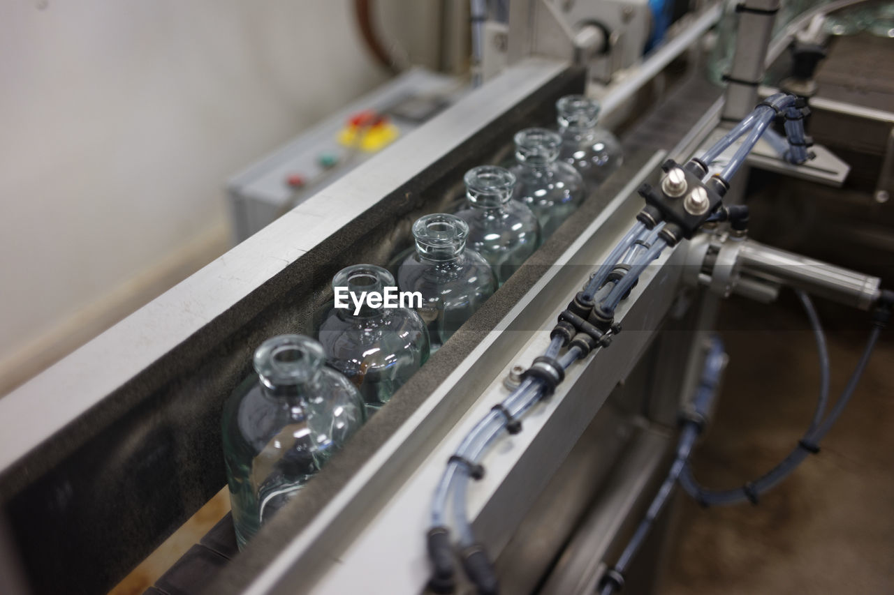 Bottles on conveyor belt in factory