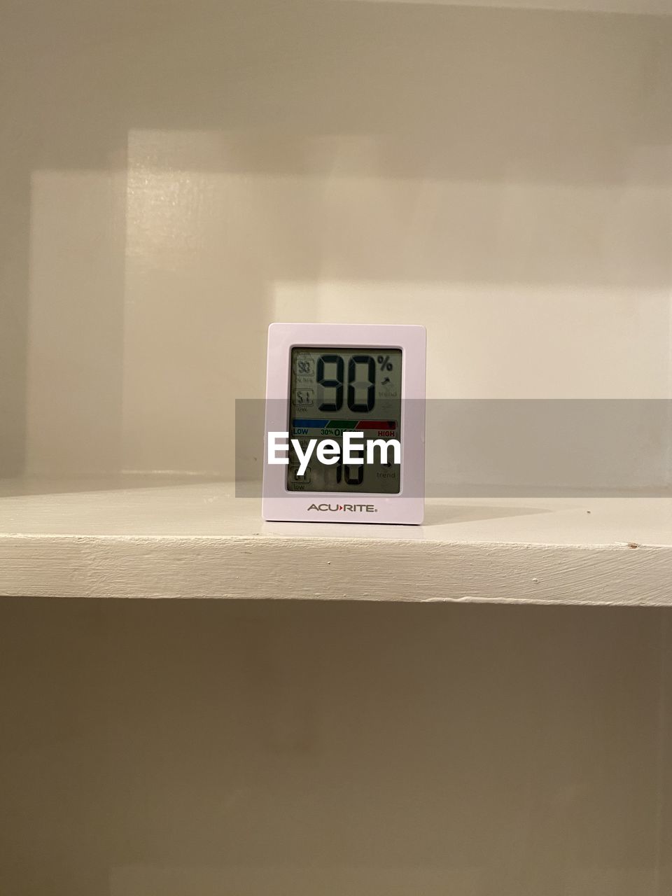 CLOSE-UP OF CLOCK ON WALL