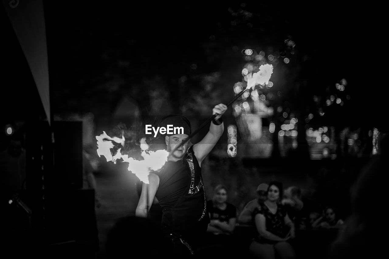 GROUP OF PEOPLE ENJOYING MUSIC CONCERT