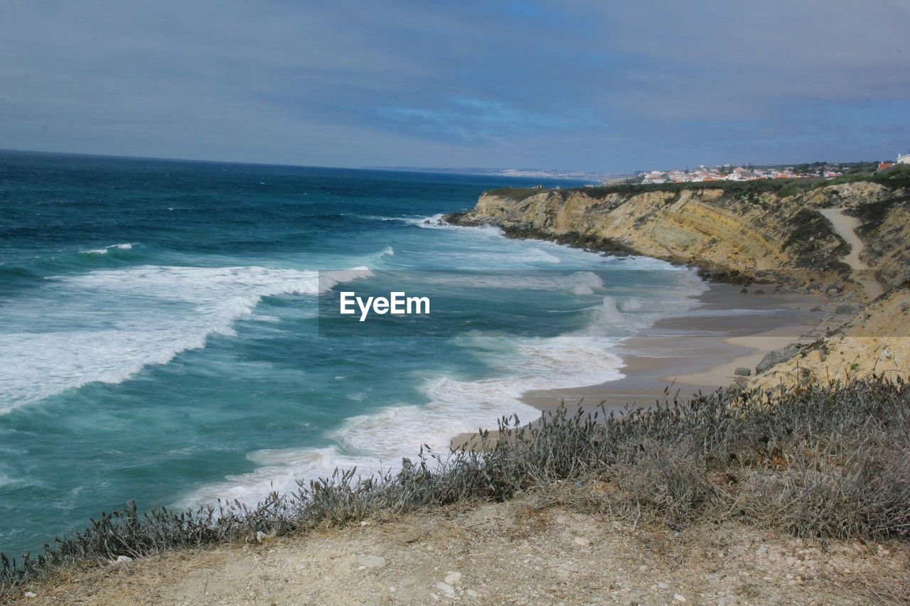 Scenic view of beach against sky