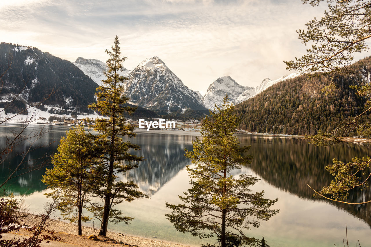 Scenic view of lake and mountains against sky