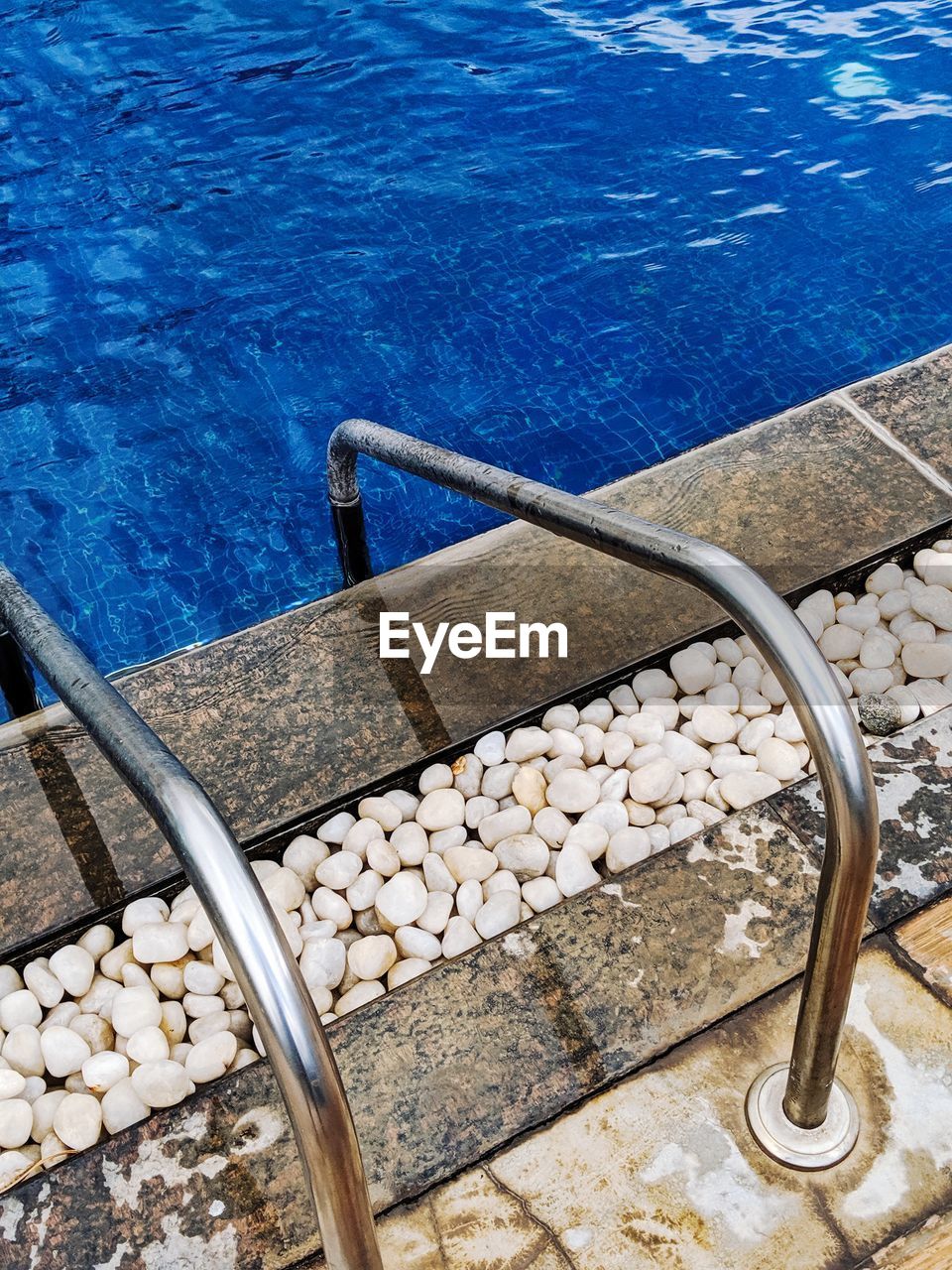 High angle view of pebbles on shore