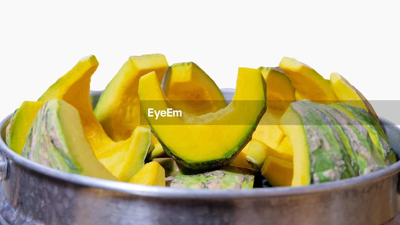 Close-up of fruits in glass bowl on table