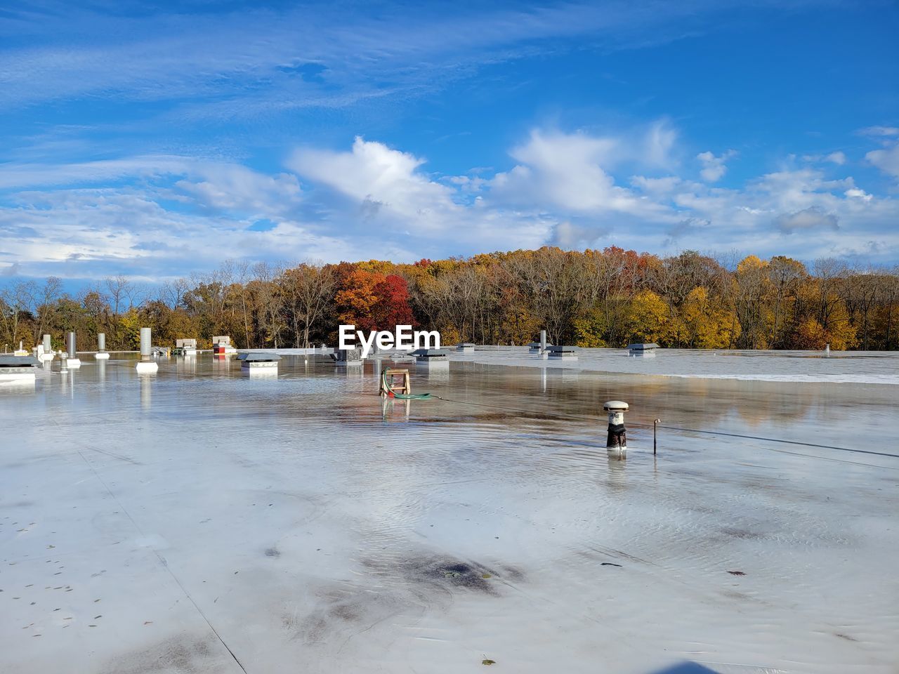 Scenic view of roof water against sky during autumn 