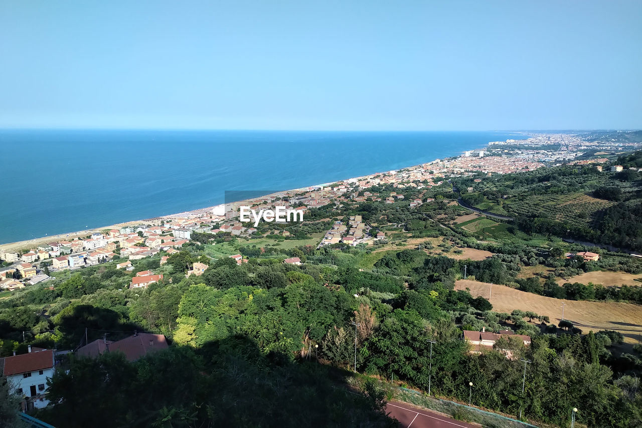 Scenic view of sea against clear blue sky