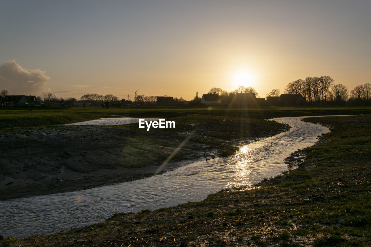 SCENIC VIEW OF SUNSET OVER LAND