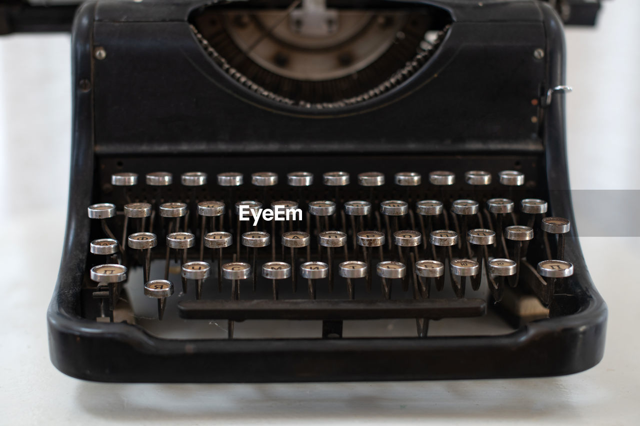 Black typewriter with the russian alphabet. vintage device for typing.  typing machine. keys close u