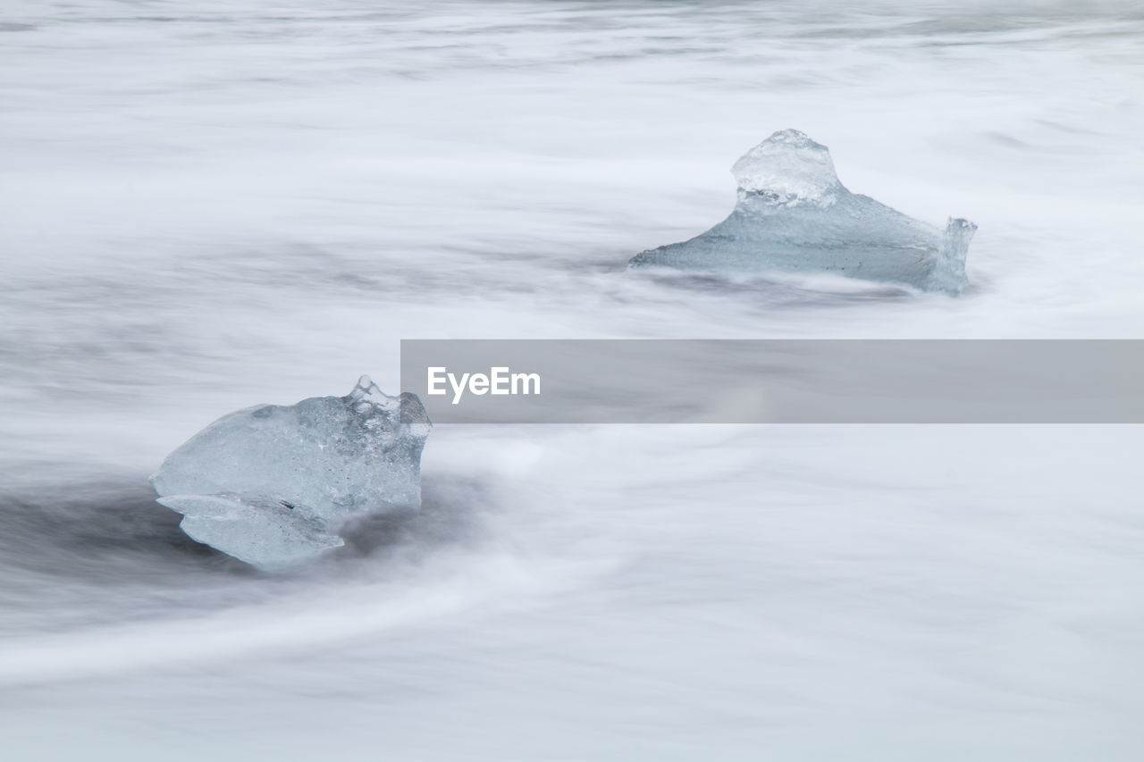 Rocks in sea during winter