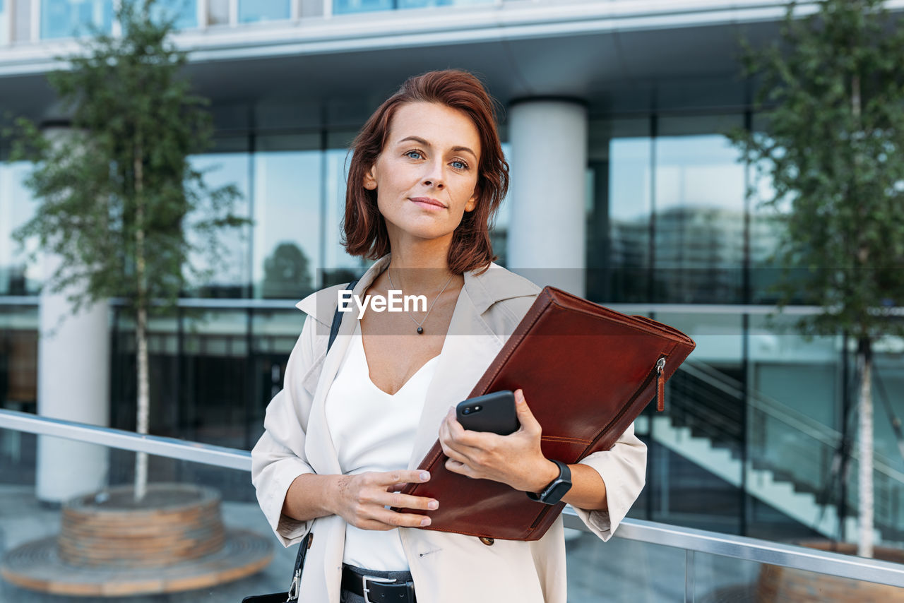 portrait of young woman using mobile phone