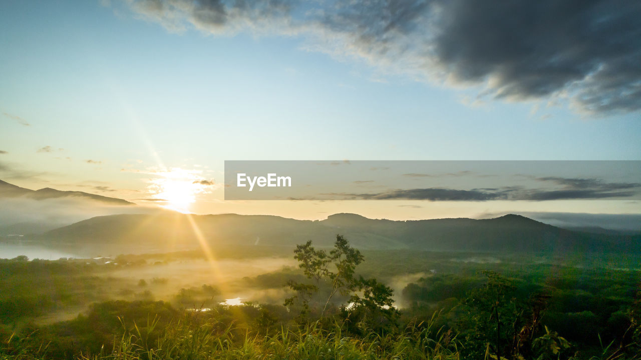 Scenic view of landscape against sky during sunset