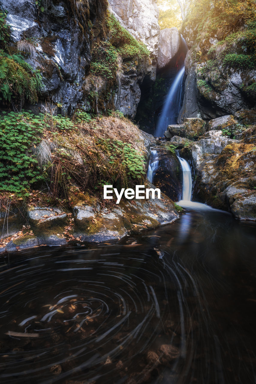 SCENIC VIEW OF WATERFALL