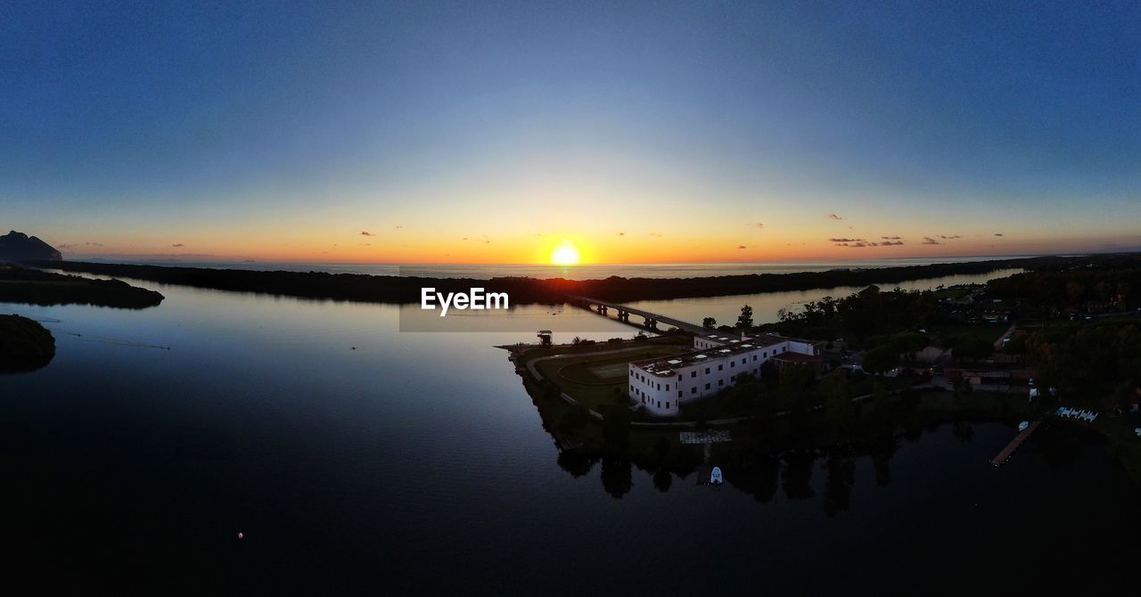 SCENIC VIEW OF LAKE DURING SUNSET