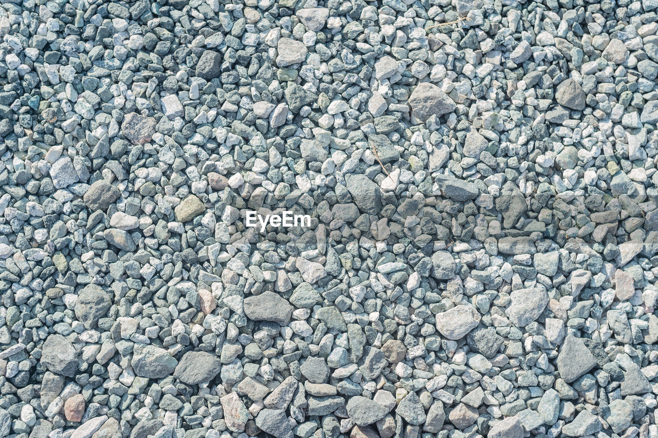 backgrounds, full frame, asphalt, gravel, textured, stone, no people, rock, high angle view, road surface, day, abundance, pattern, pebble, nature, rubble, large group of objects, gray, outdoors, cobblestone, soil, rough, flooring, land, close-up, directly above