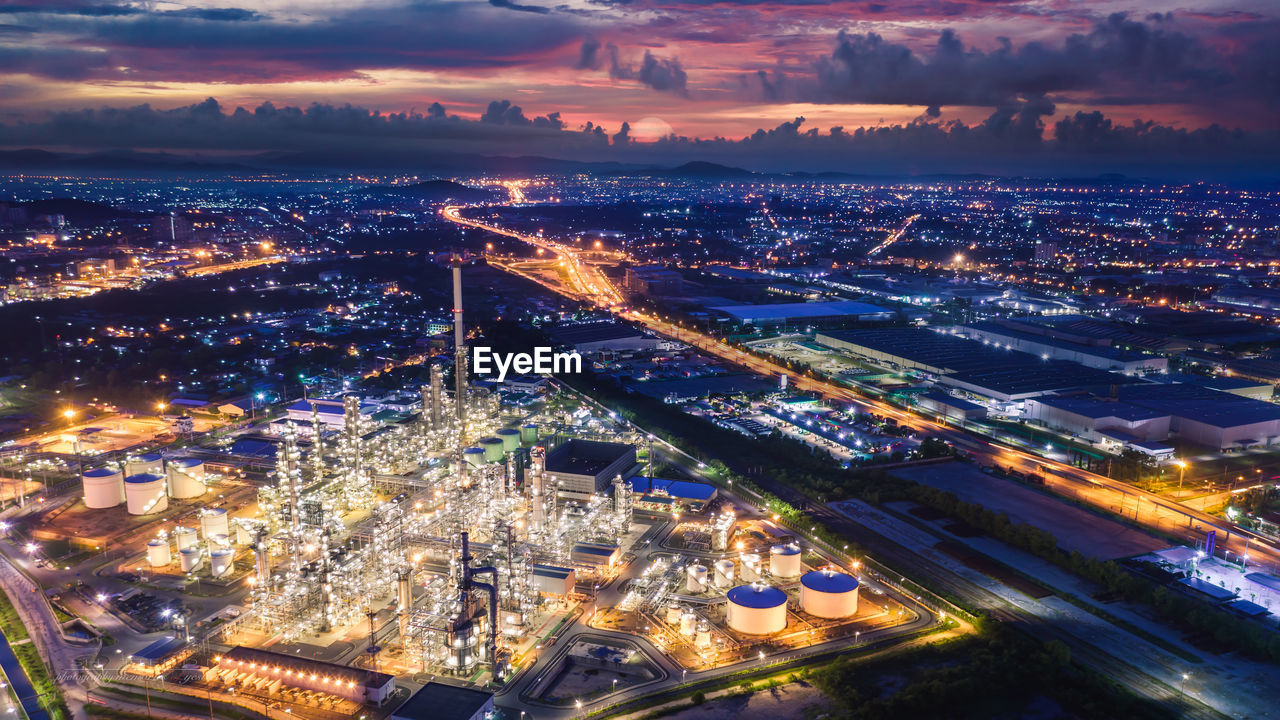 Refinery industry zone at night and lighting cityscape with twilight sky background 