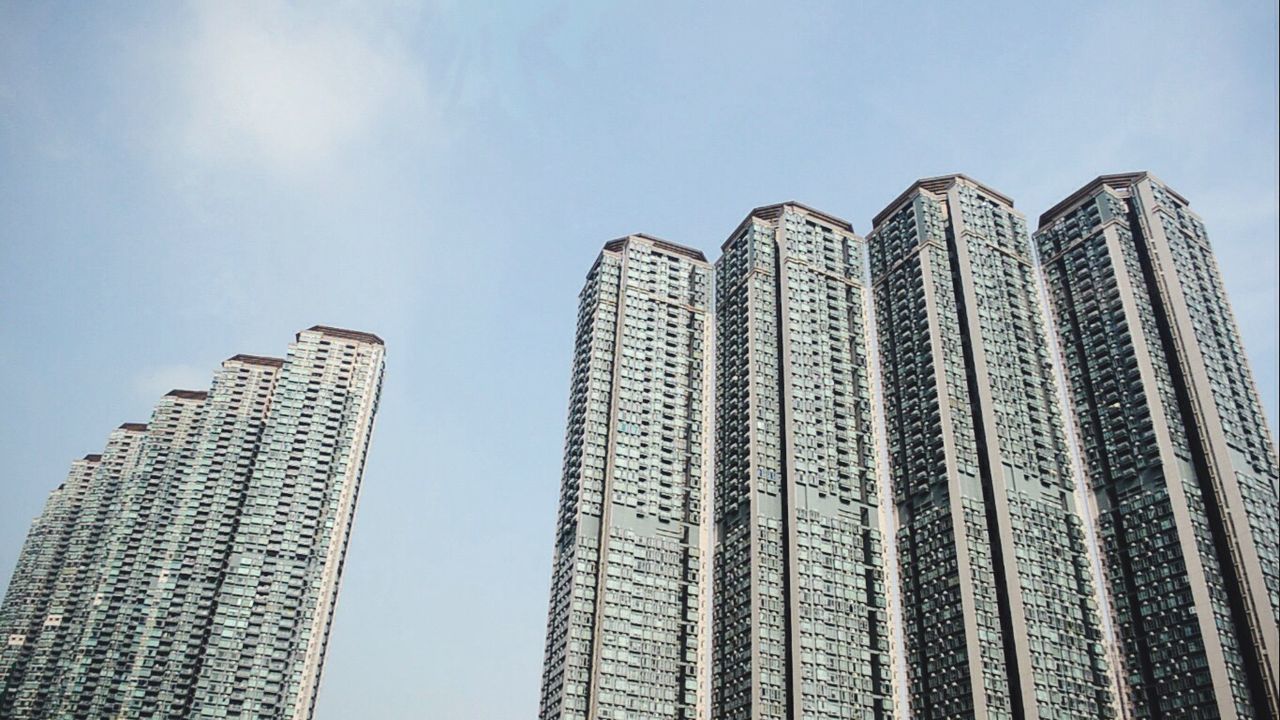 Low angle view of modern buildings against sky