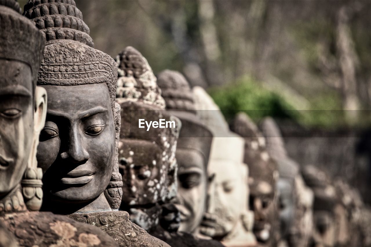 CLOSE-UP OF STATUE OF BUDDHA