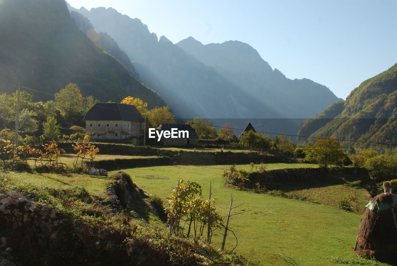 SCENIC VIEW OF LANDSCAPE AND MOUNTAINS AGAINST SKY