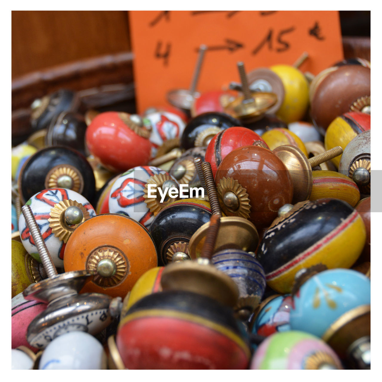 Multi colored doorknob for sale at market stall