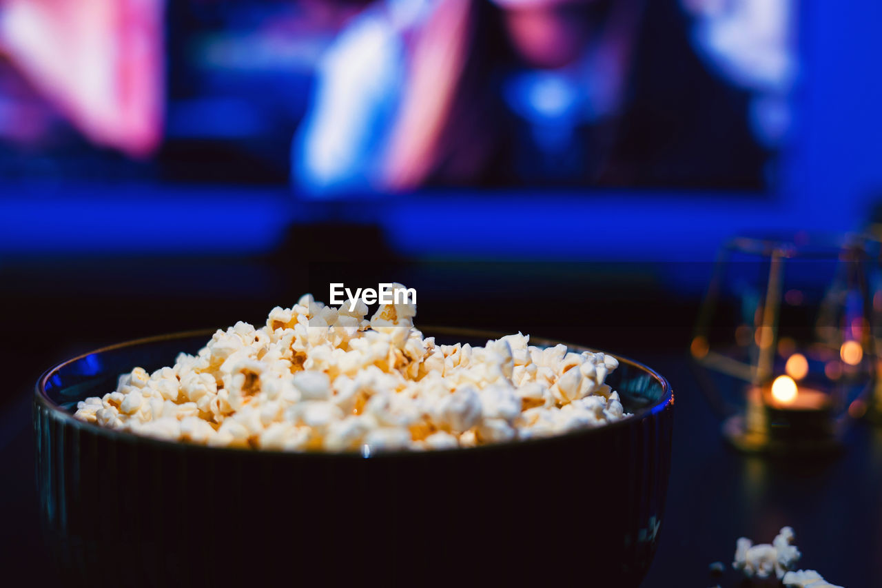 popcorn, kettle corn, food and drink, food, snack, movie theater, movie, indoors, arts culture and entertainment, unhealthy eating, focus on foreground