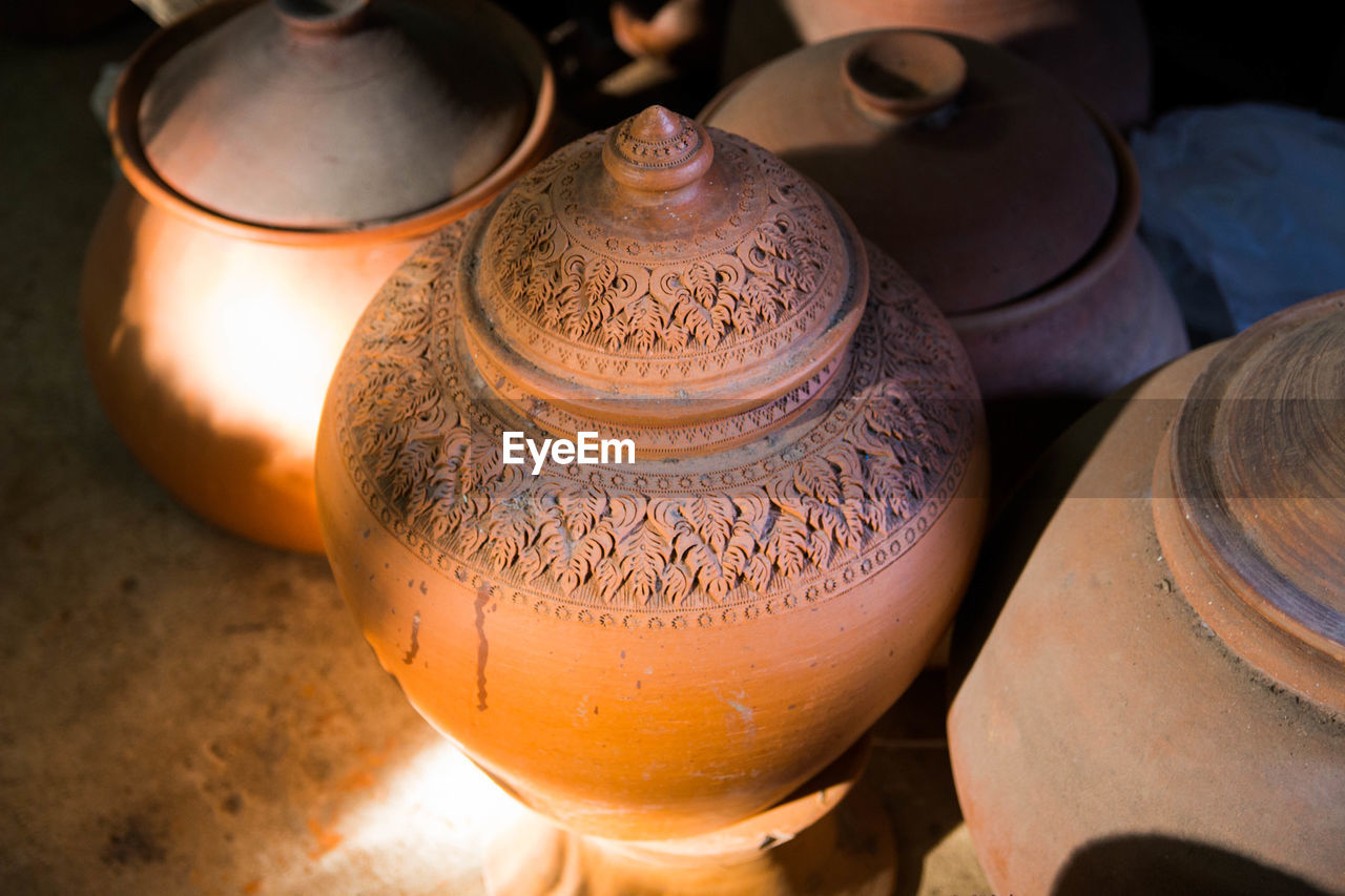 Various clay pots for sale at market stall