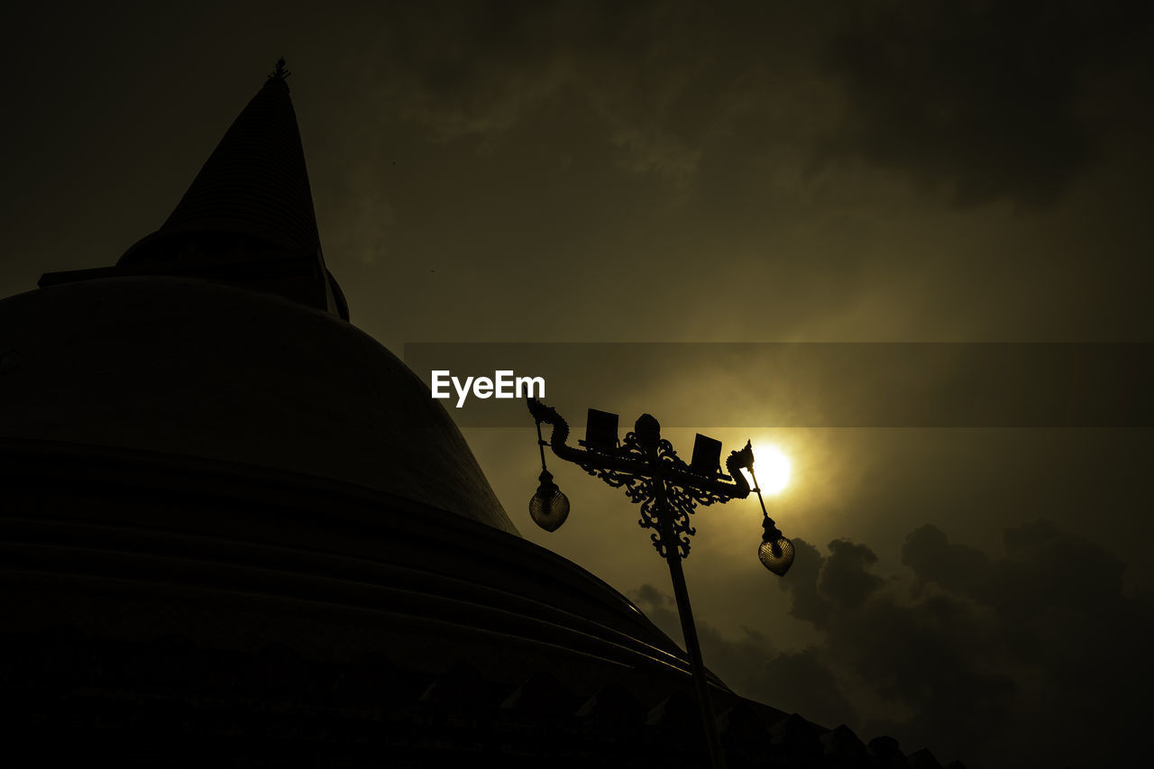 darkness, sky, architecture, night, light, silhouette, religion, built structure, belief, cloud, evening, nature, temple - building, no people, history, travel destinations, low angle view, building exterior, sunset, spirituality, the past, place of worship, building, dusk, pagoda, outdoors, sculpture, travel, ancient
