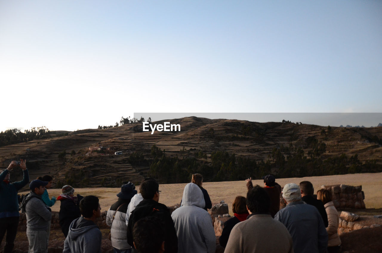 Tourists with mountain in the background