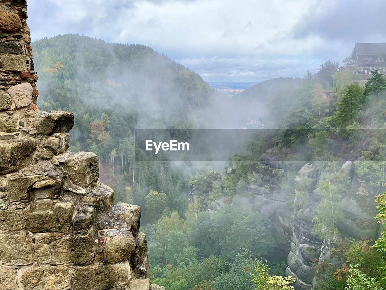 Aerial view of landscape with mountain range in background