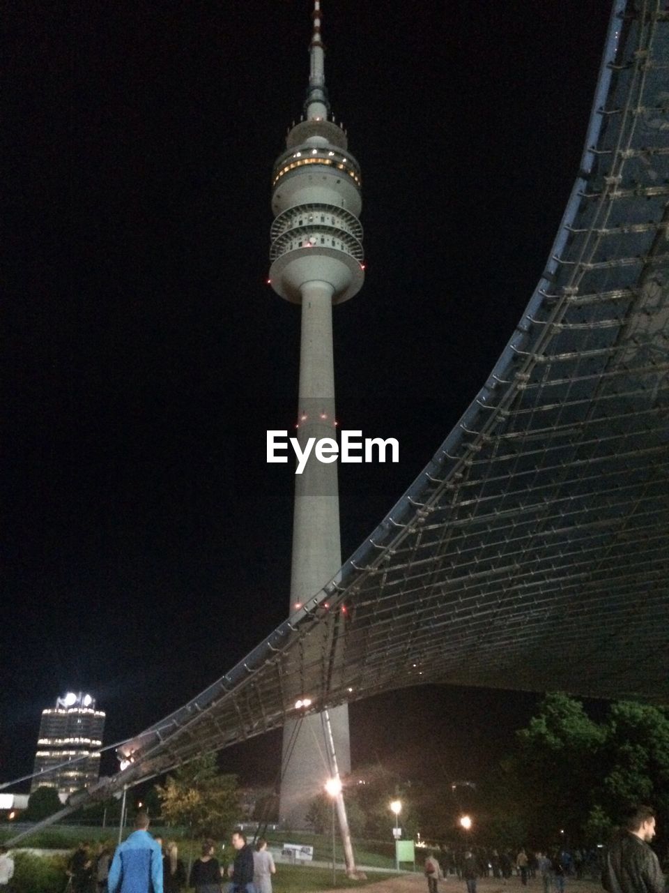 LOW ANGLE VIEW OF TOWER AT NIGHT