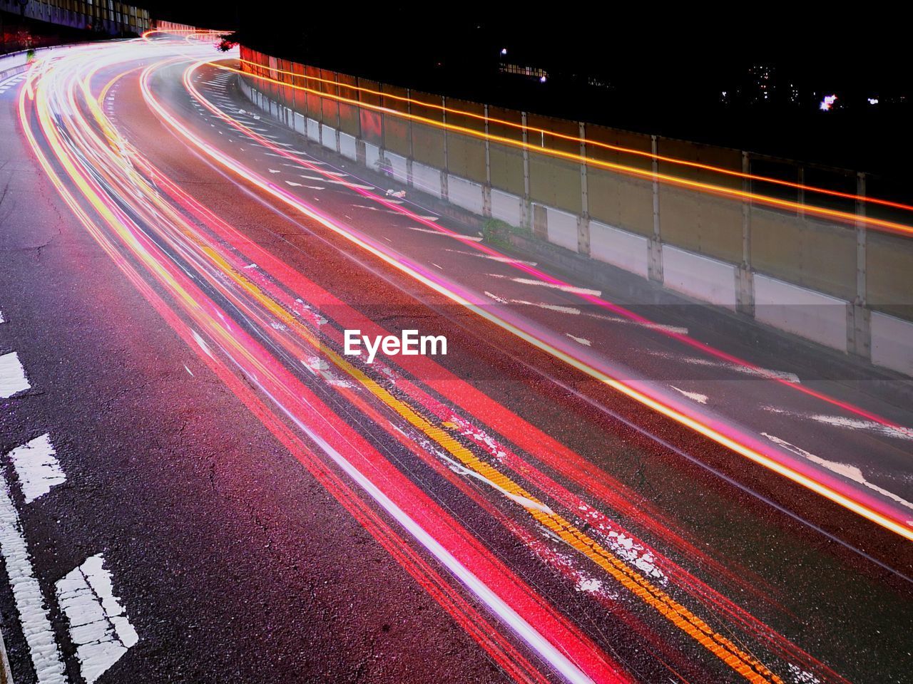 High angle view of light trails on road at night