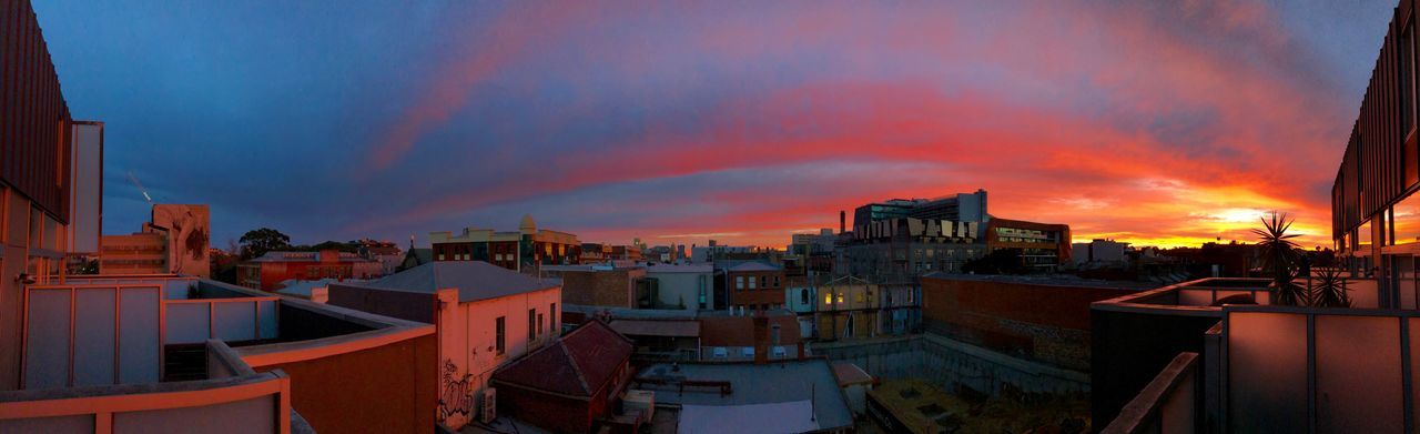 High angle view of buildings against sky during sunset