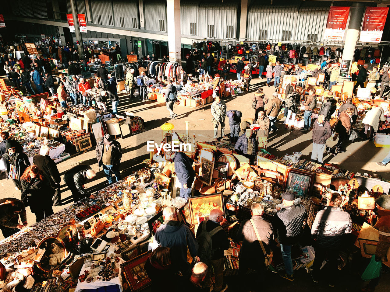 HIGH ANGLE VIEW OF PEOPLE ON STREET MARKET