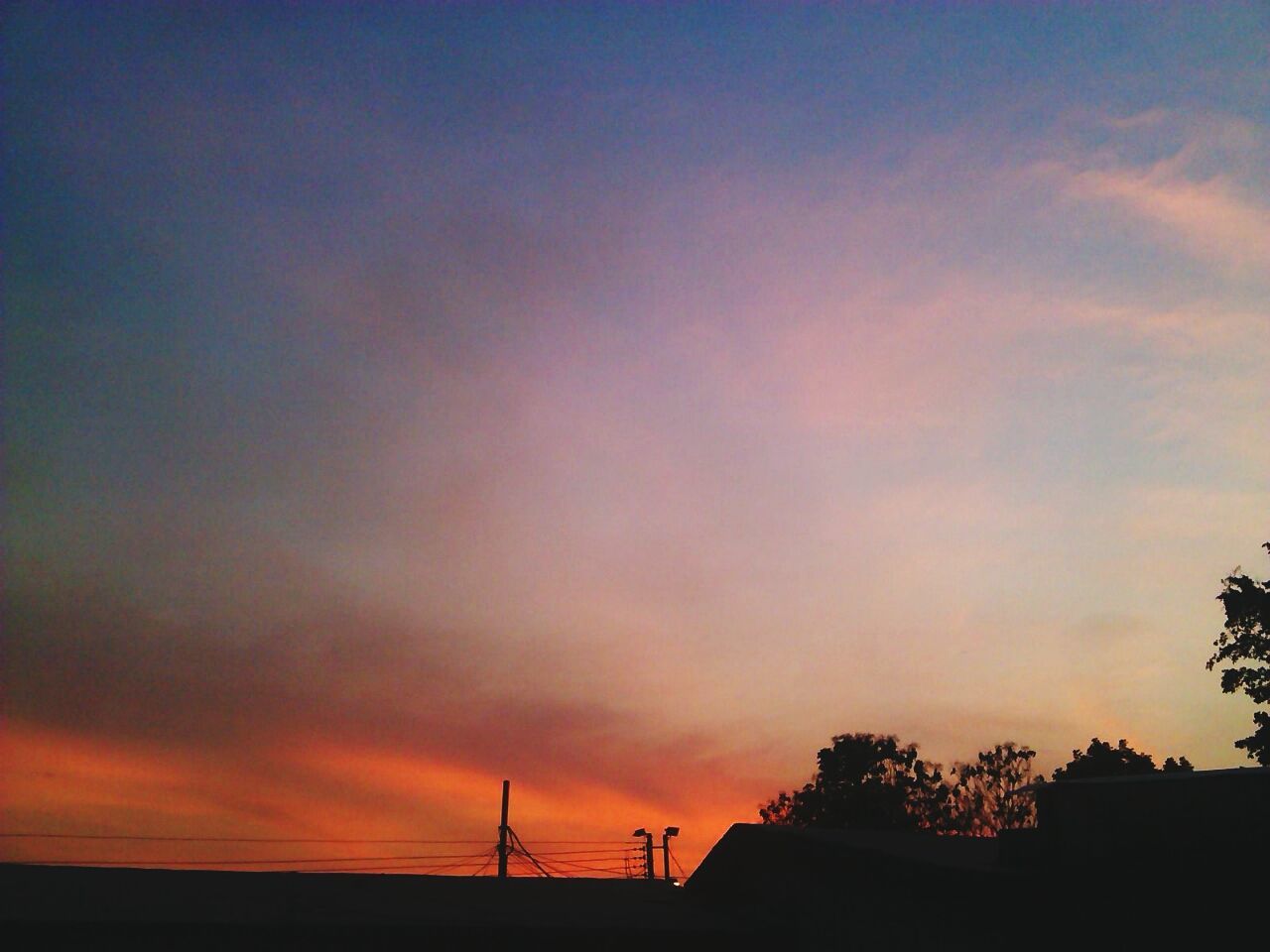 Silhouette of building at sunset