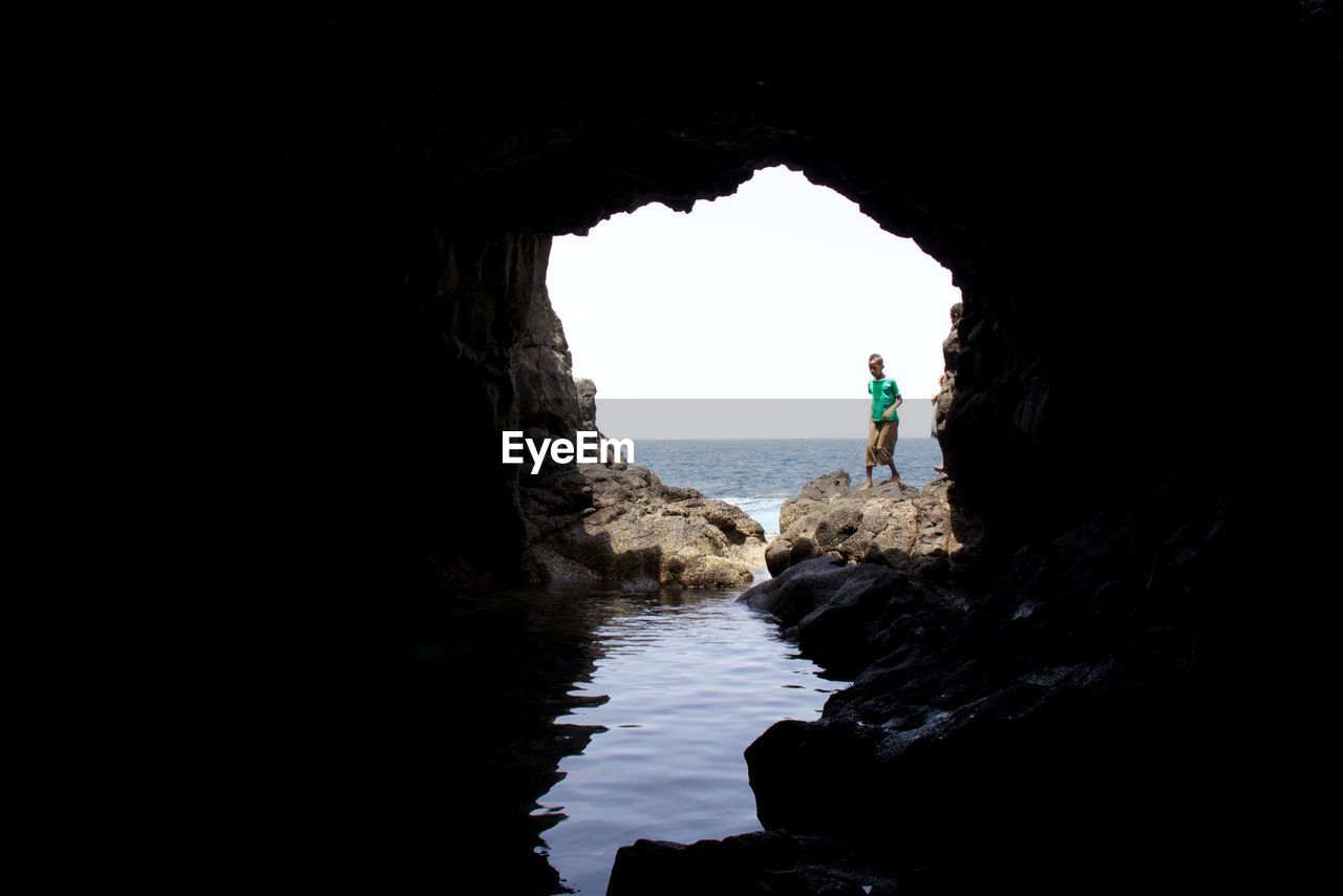 SCENIC VIEW OF SEA SEEN THROUGH ARCH