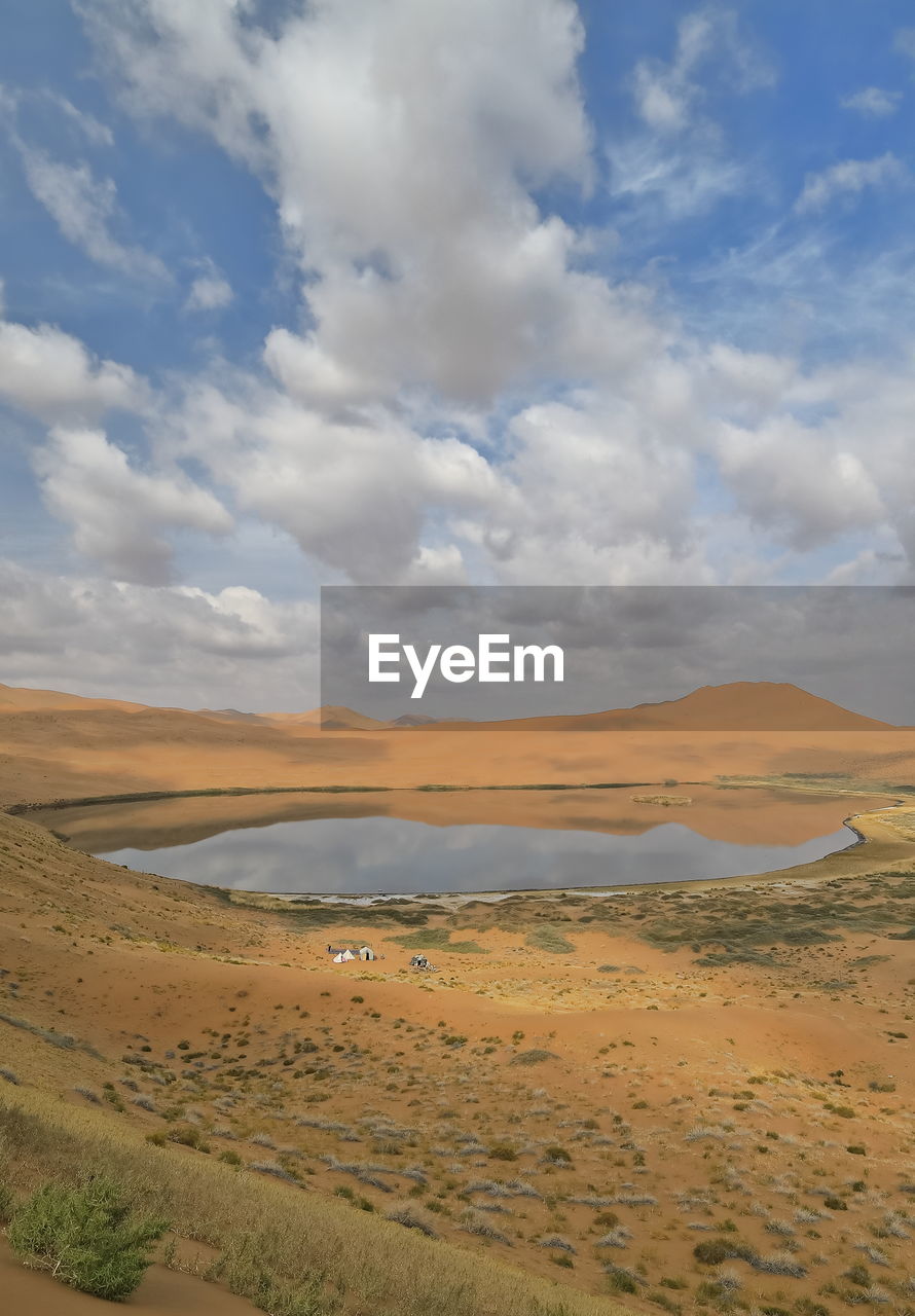 1076 lake zhalate-badain jaran desert-nomadic yurts-dune and sky reflection. inner mongolia-china.