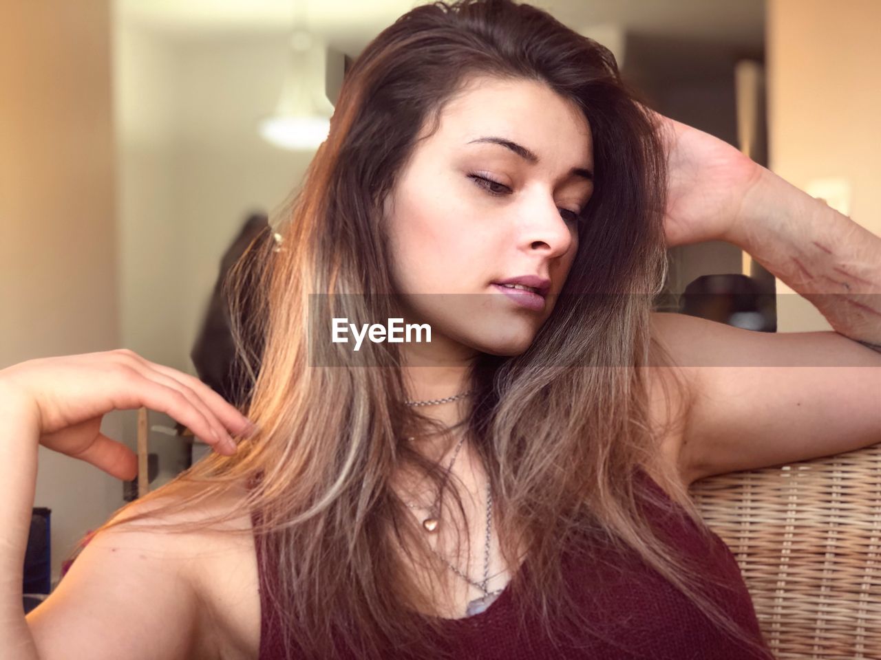 Close-up of thoughtful young woman with long hair 