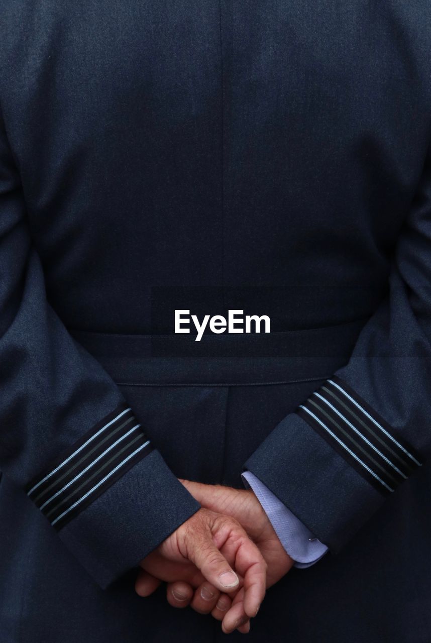 Rear view of man wearing uniform