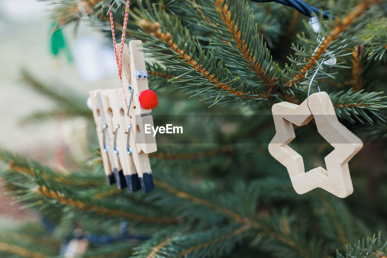 Diy wood clothespin decoration on christmas tree