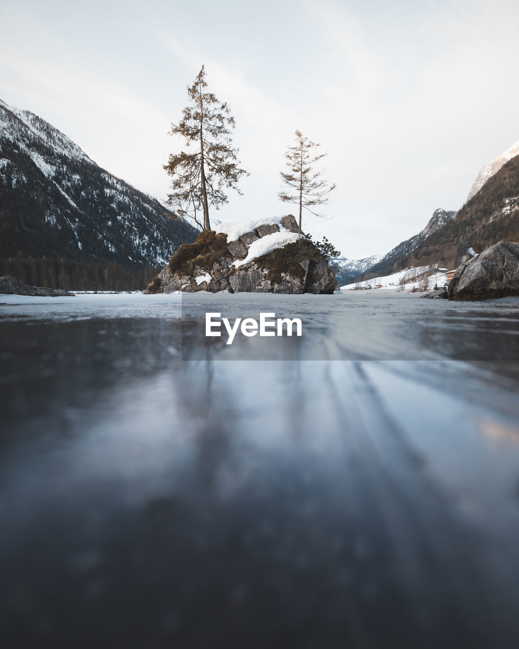 Surface level of frozen lake by mountains