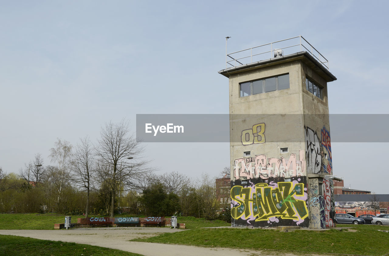 Graffiti on observation tower against clear sky