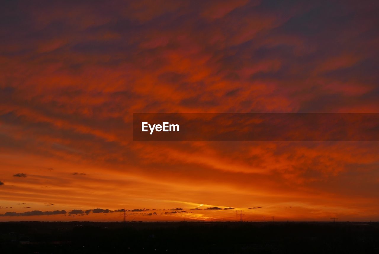 SCENIC VIEW OF LANDSCAPE AGAINST DRAMATIC SKY