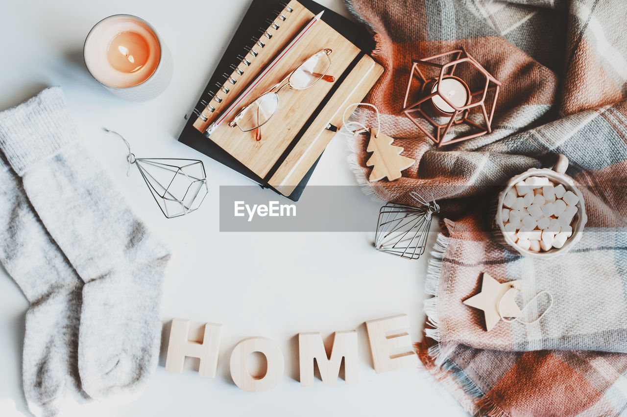 High angle view of decoration and eyeglasses on table