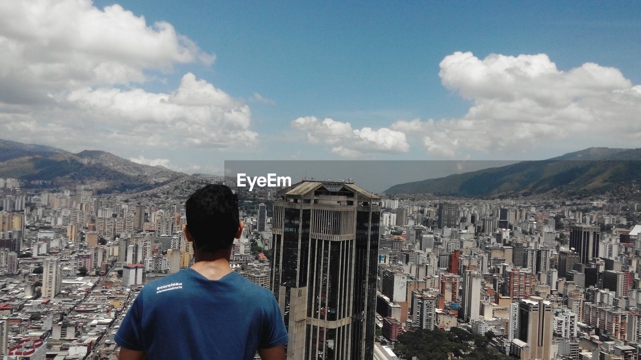 Man overlooking cityscape