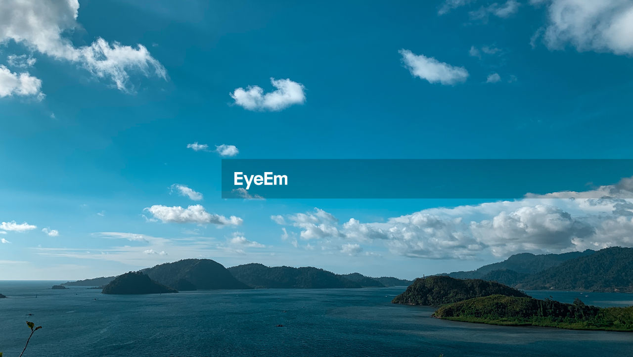 Scenic view of sea against blue sky