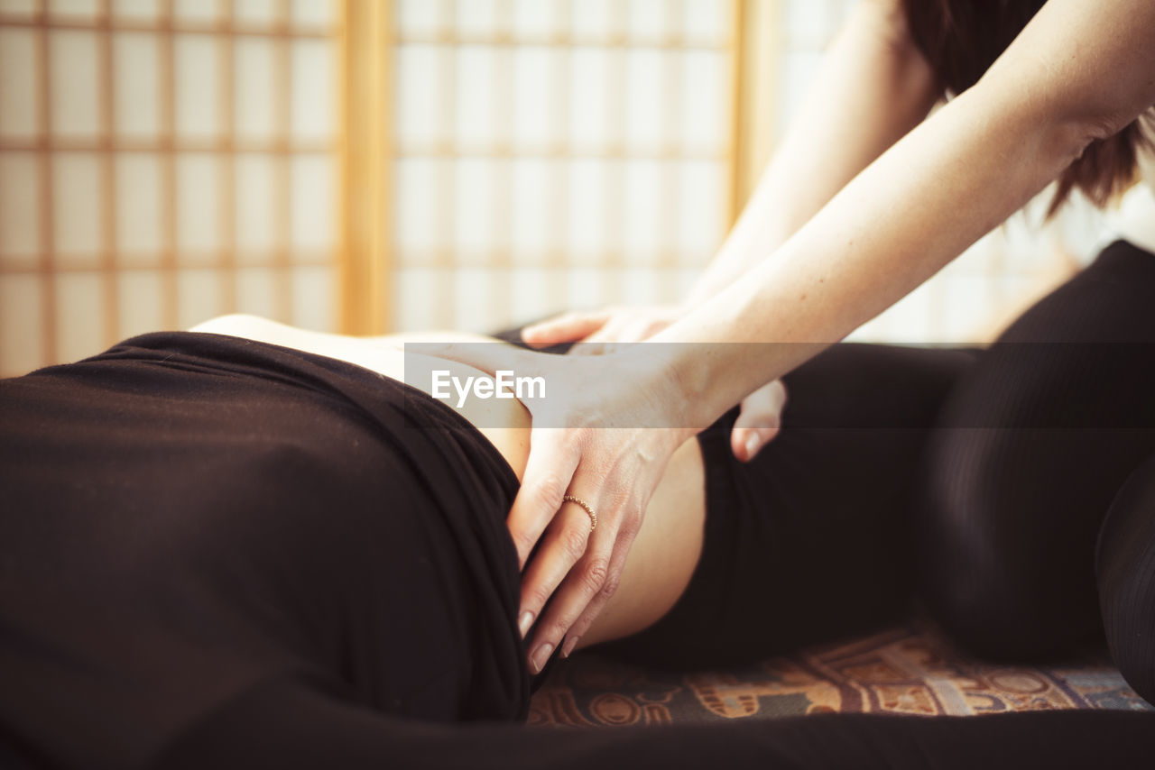 Close up of massage therapy at home in apartment during quarantine