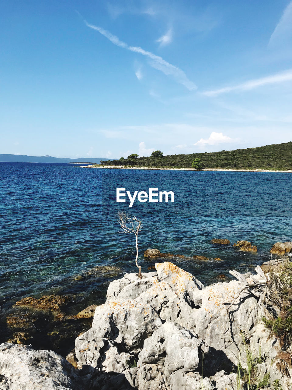 Scenic view of sea against blue sky