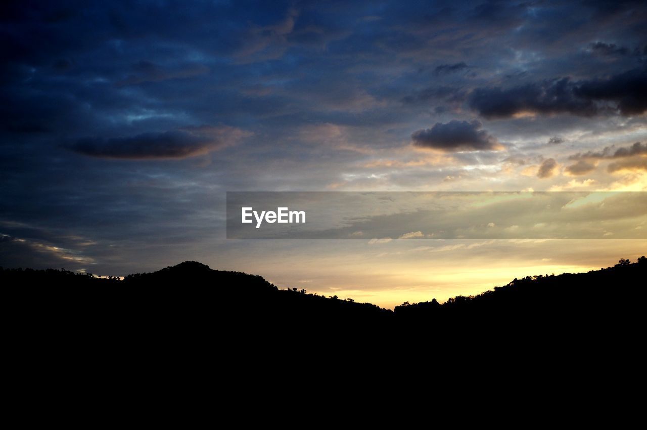 SCENIC VIEW OF SILHOUETTE LANDSCAPE AGAINST SKY DURING SUNSET