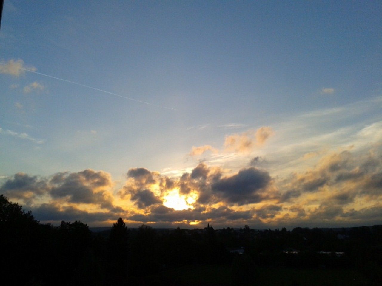 SILHOUETTE OF LANDSCAPE AGAINST SKY AT SUNSET