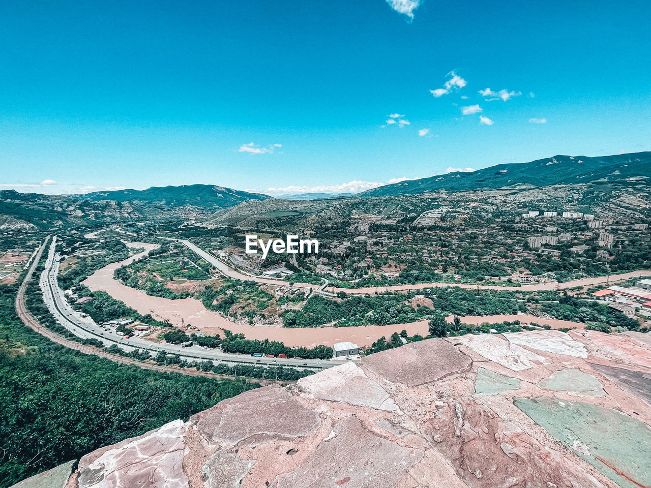 landscape, environment, sky, aerial photography, scenics - nature, nature, mountain, blue, beauty in nature, land, travel destinations, no people, travel, architecture, outdoors, tranquility, aerial view, mountain range, high angle view, day, rural scene, city, tranquil scene, sunny, road, tourism, clear sky, cloud, built structure