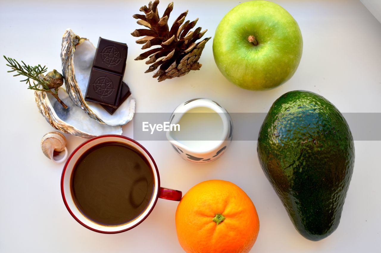 HIGH ANGLE VIEW OF APPLE AND FRUITS ON TABLE